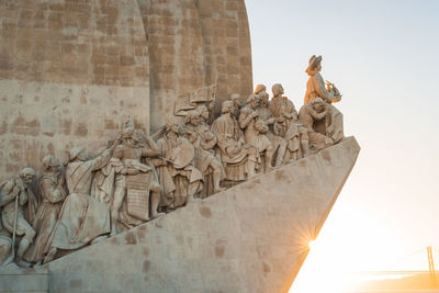 Statue of historic building against sky