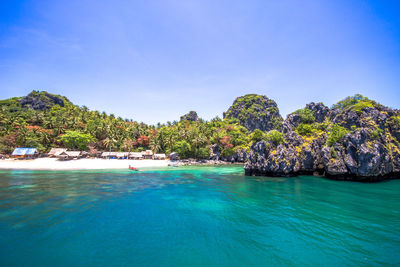 Scenic view of sea against blue sky