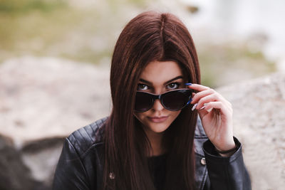 Portrait of young woman wearing sunglasses