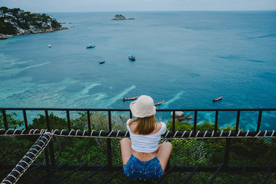 Rear view of woman looking at sea