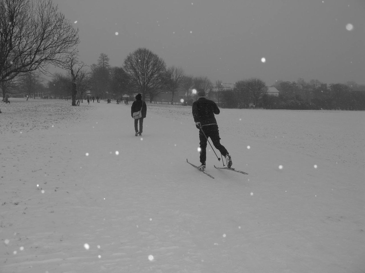 PEOPLE ON SNOWY FIELD