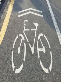 High angle view of bicycle sign on road