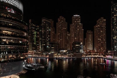 Illuminated buildings in city at night