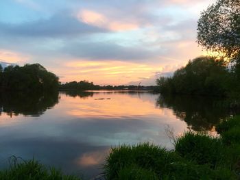 Scenic view of lake against sky during sunset