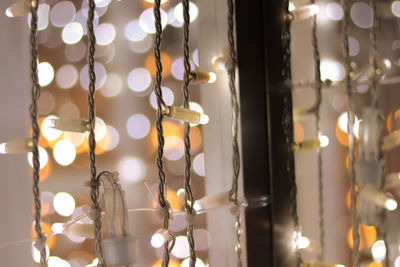 Close-up of illuminated string lights at home
