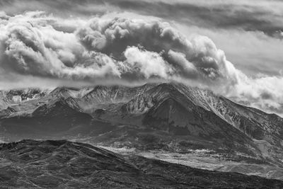 Scenic view of snowcapped mountains against sky