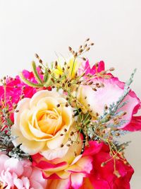 Close-up of pink rose bouquet against white background