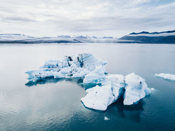 Scenic view of frozen sea against sky