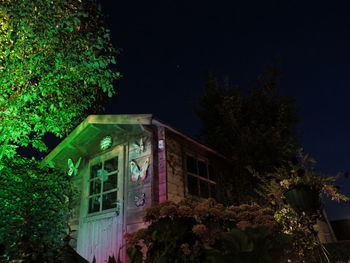 Low angle view of building against sky at night