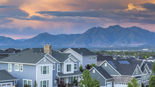 Houses and mountains against sky