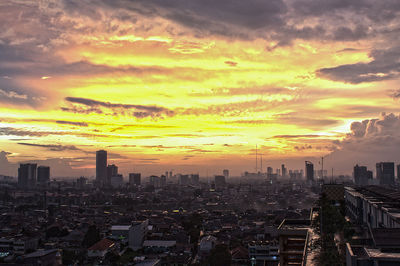 High angle view of buildings against sky during sunset