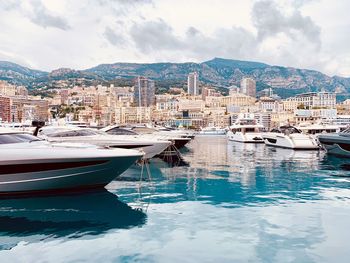 Panoramic view of sea and buildings against sky