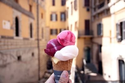 Man holding pink flowers