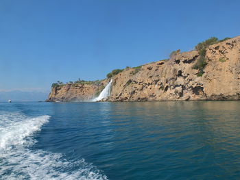 Scenic view of sea against clear blue sky