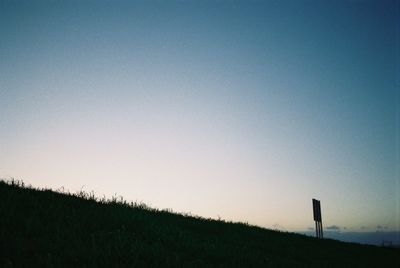 Countryside landscape against clear blue sky