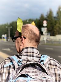 Rear view of man with umbrella