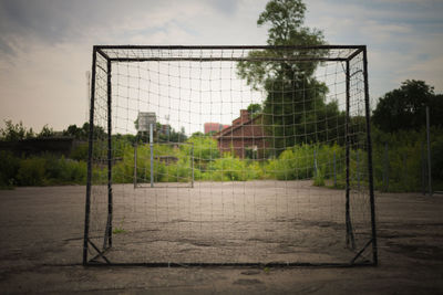 View of soccer field against cloudy sky