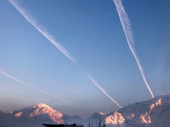 Low angle view of vapor trails in sky