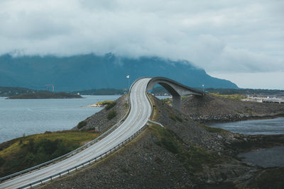 Road by sea against sky