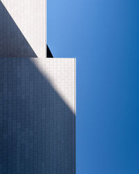 Low angle view of building against clear blue sky