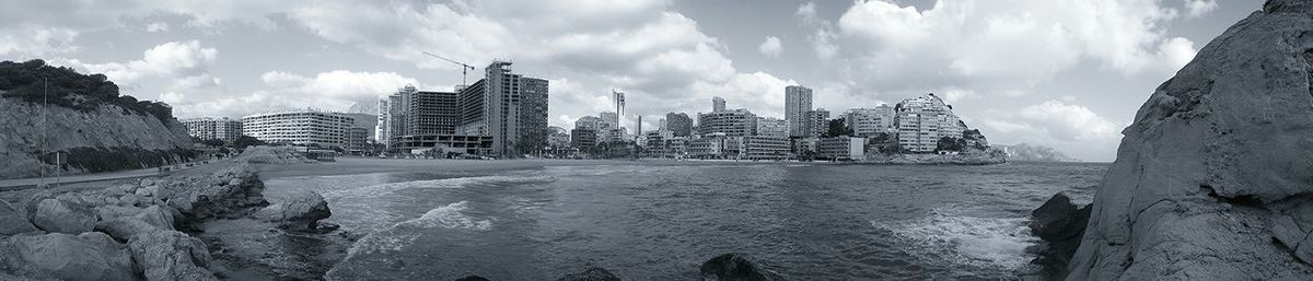 View of buildings against cloudy sky