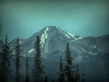 Scenic view of mountains against sky during winter