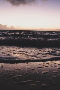 Scenic view of beach against sky during sunset