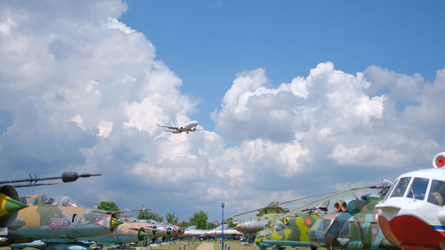 Low angle view of airplane flying against sky