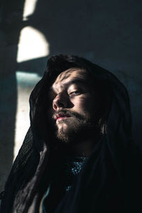 Portrait of young man looking away