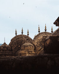 Low angle view of temple against building