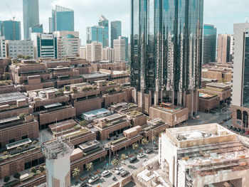 View of a cloudy day in a modern city, downtown abu dhabi landmarks, world trade center towers