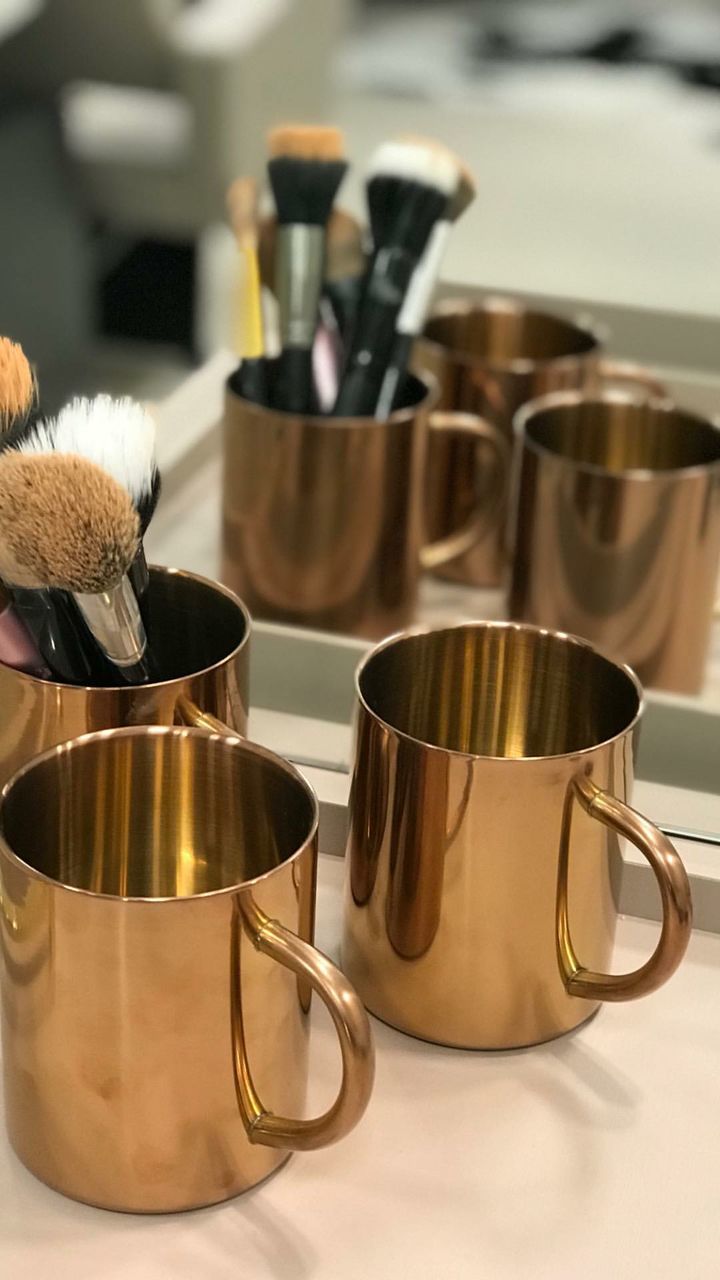 still life, indoors, cup, no people, mug, table, close-up, variation, focus on foreground, coffee cup, choice, food and drink, container, metal, kitchen utensil, group of objects, large group of objects, selective focus, drink, make-up brush, crockery, clean, saucepan