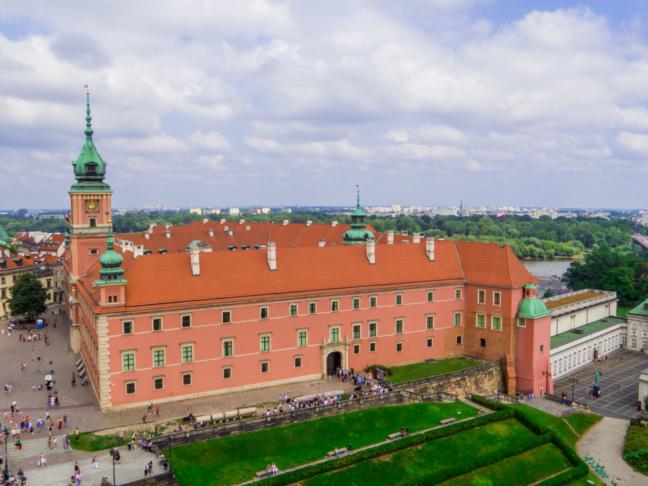 architecture, building exterior, built structure, travel destinations, history, building, city, the past, sky, travel, cloud, tourism, nature, landmark, high angle view, tower, town, château, crowd, town square, cityscape, outdoors, plant, estate, group of people, palace, day, ancient, religion, mansion, tourist, landscape, old, large group of people, street, roof, environment, city life, water, place of worship, holiday, grass, tree, residential district, trip