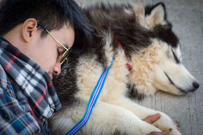 Midsection of man holding dog