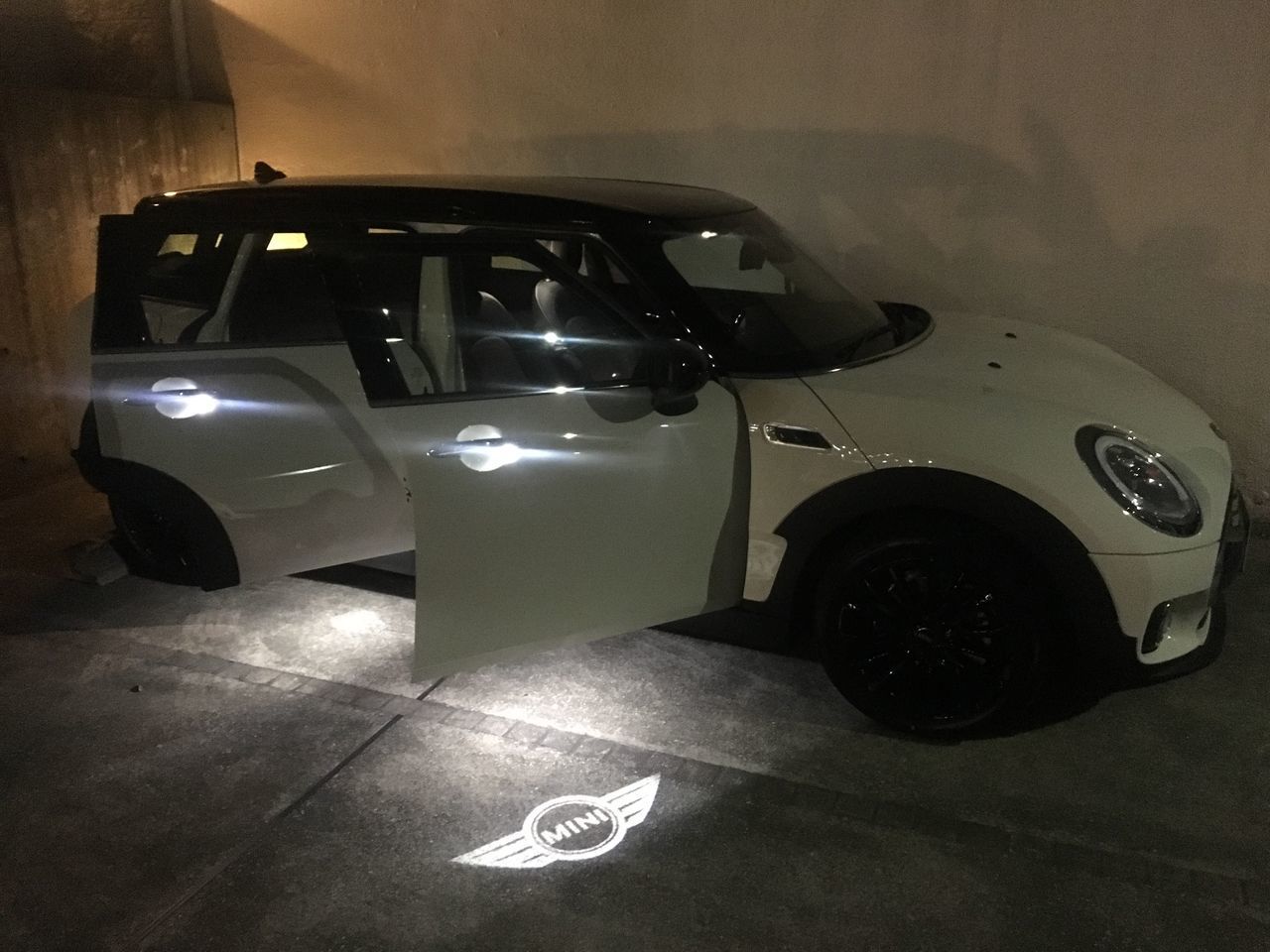 HIGH ANGLE VIEW OF TOY CAR ON TABLE IN ILLUMINATED UNDERGROUND