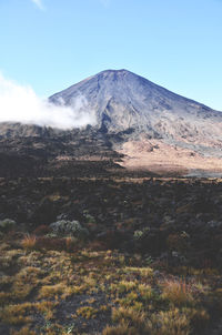 View of volcanic landscape against sky