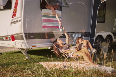 Girls relaxing on sun loungers