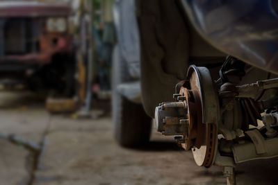 Close-up rusty disk break with hub wheel and auto hub lock of 4x4 car background.