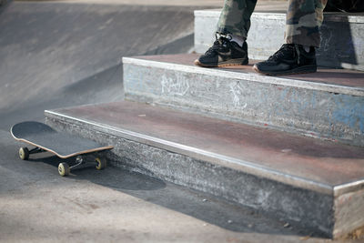 Low section of person standing on skateboard