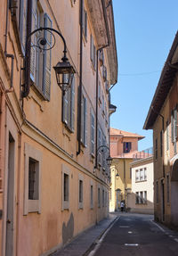 Street amidst buildings against sky