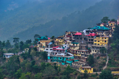 High angle view of buildings in city against sky