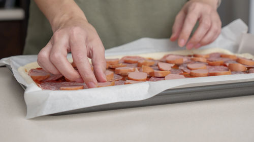 Midsection of man preparing food