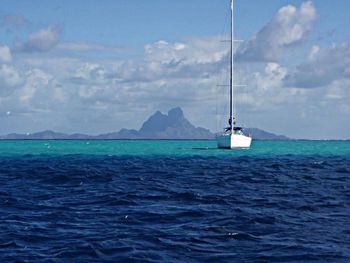 Scenic view of sea against cloudy sky