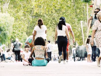 People sitting on road