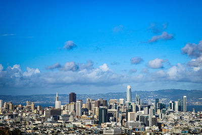 Cityscape against blue sky