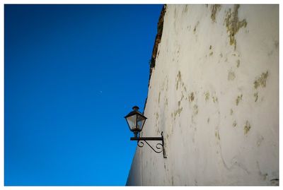 Low angle view of tree against clear blue sky