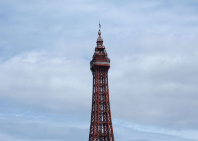 Low angle view of tower of building against cloudy sky