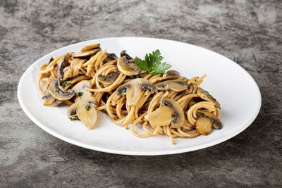 High angle view of noodles in plate on table