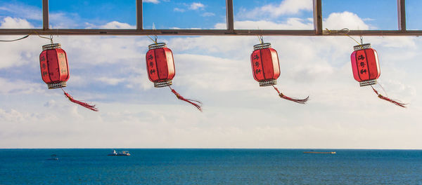 Chinese lanterns hanging over sea