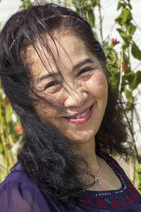 Close-up portrait of a smiling young woman